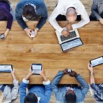 business team with mobile, laptop and e-reader devices