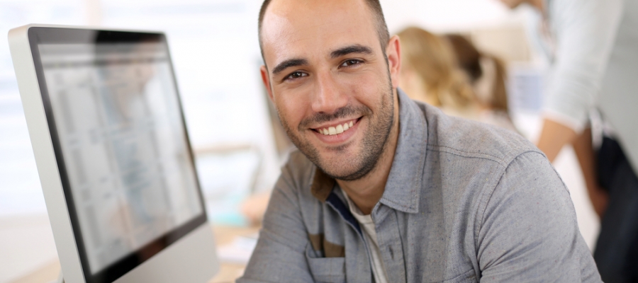 Sales guy behind a computer