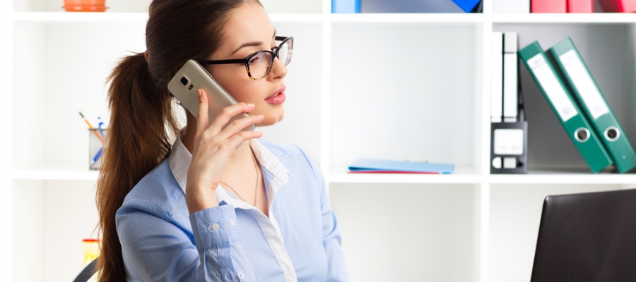 Woman working behind computer