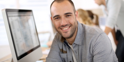 Sales guy behind a computer