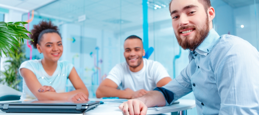 Three smiling marketers