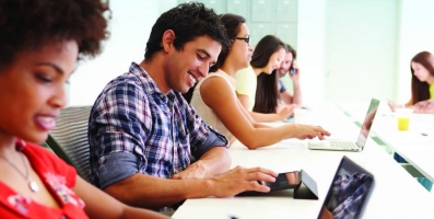 Several people checking email on multiple devices
