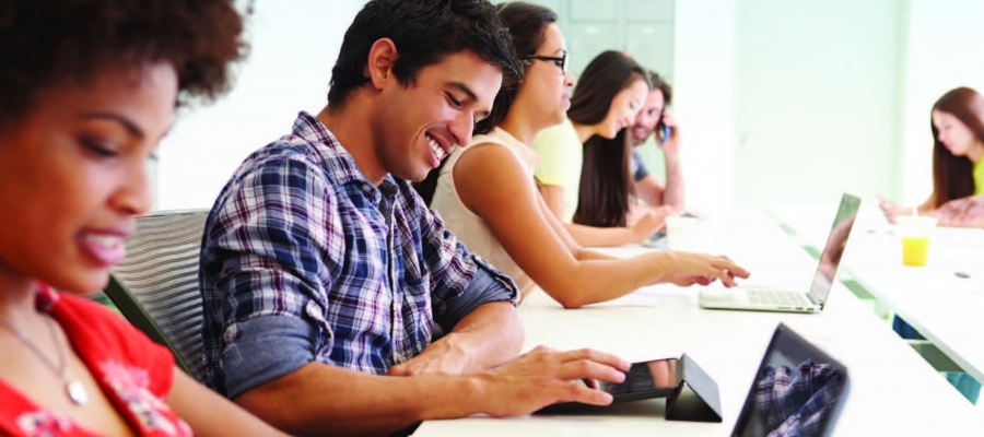 Several people checking email on multiple devices
