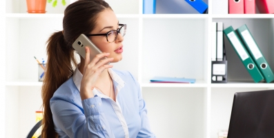 Woman working behind computer