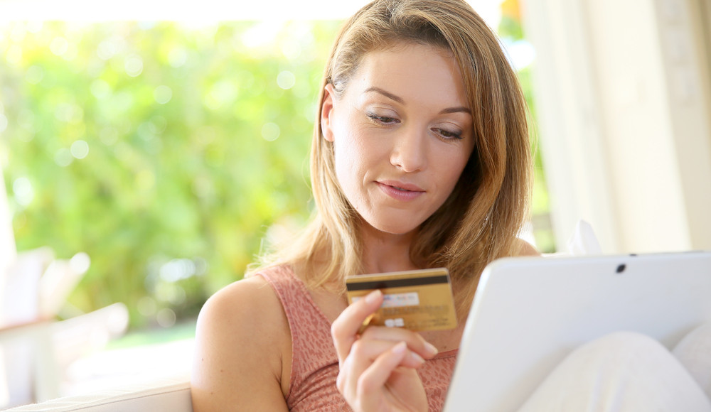 Woman making online purchase with her mobile device