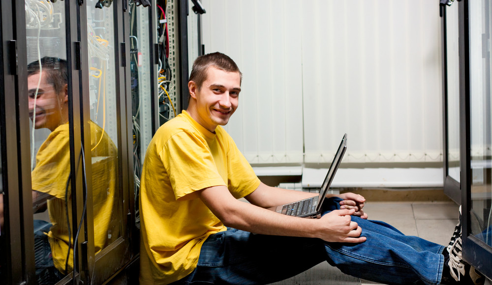 IT Guy Sitting in Data Center