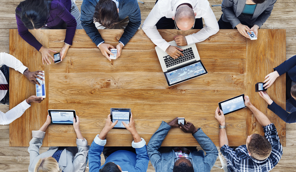 business team with mobile, laptop and e-reader devices