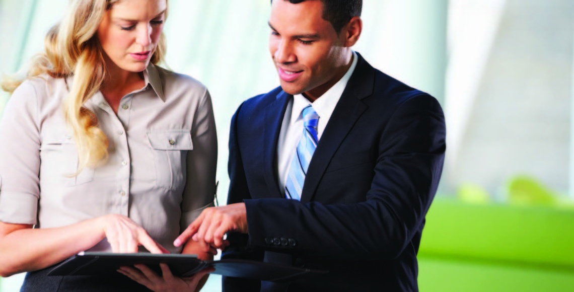 Two business people looking at tablet