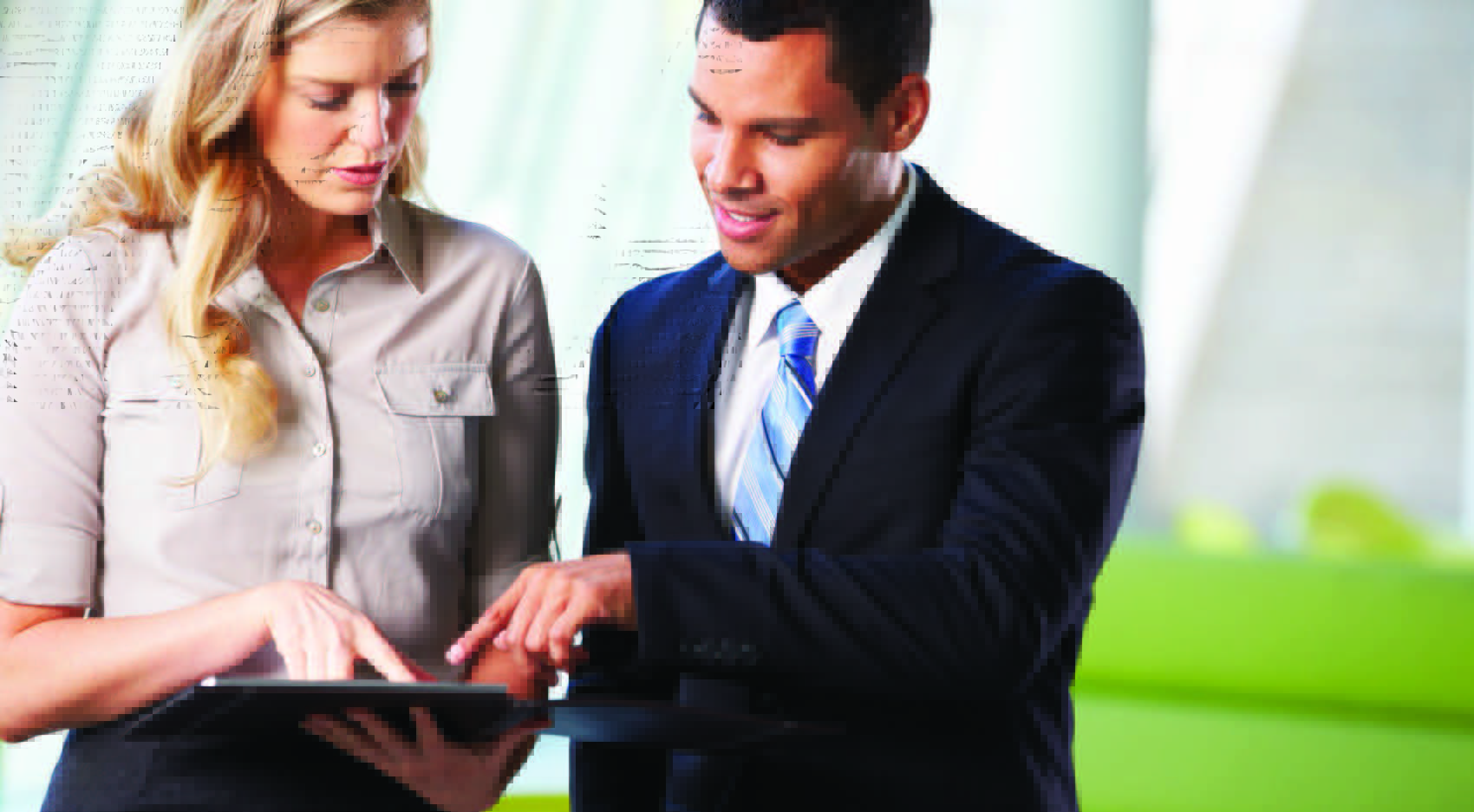 Tealium_DataAccess Two business people looking at tablet